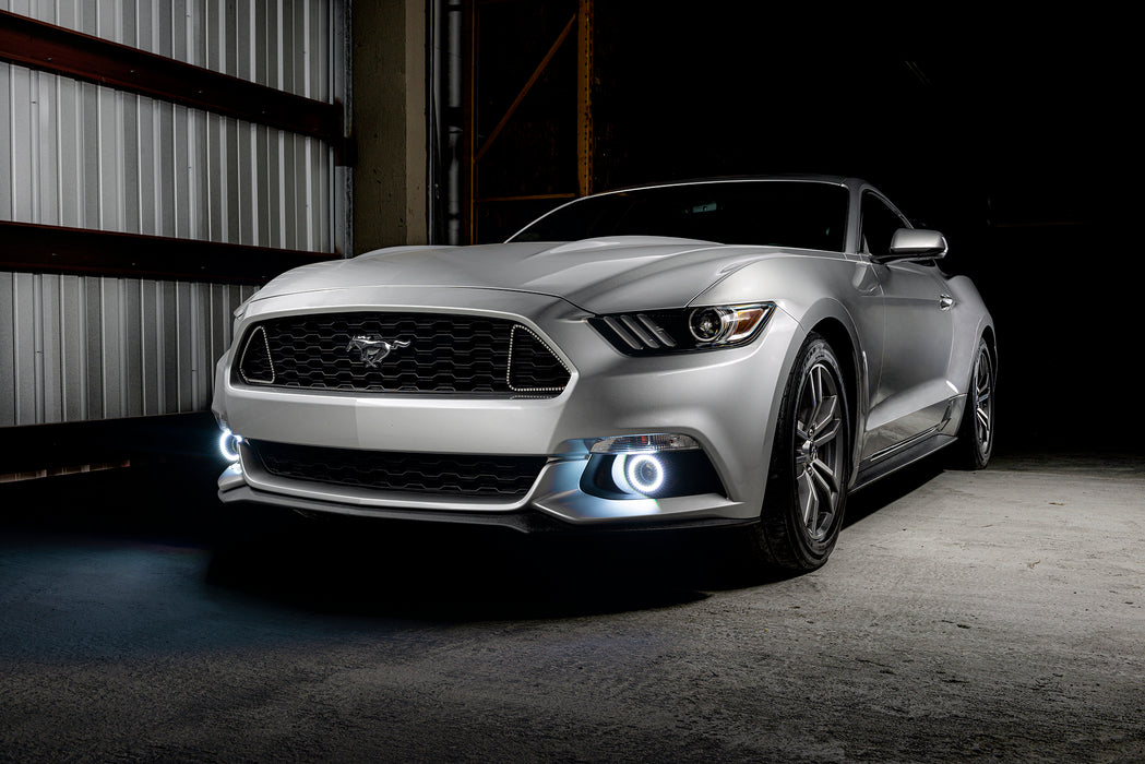 Silver mustang with white fog light halos