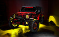 Three quarters view of a red Jeep Wrangler JL, with ColorSHIFT Oculus Headlights, and yellow halo rings.