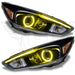 Ford Focus headlights with yellow halo rings.